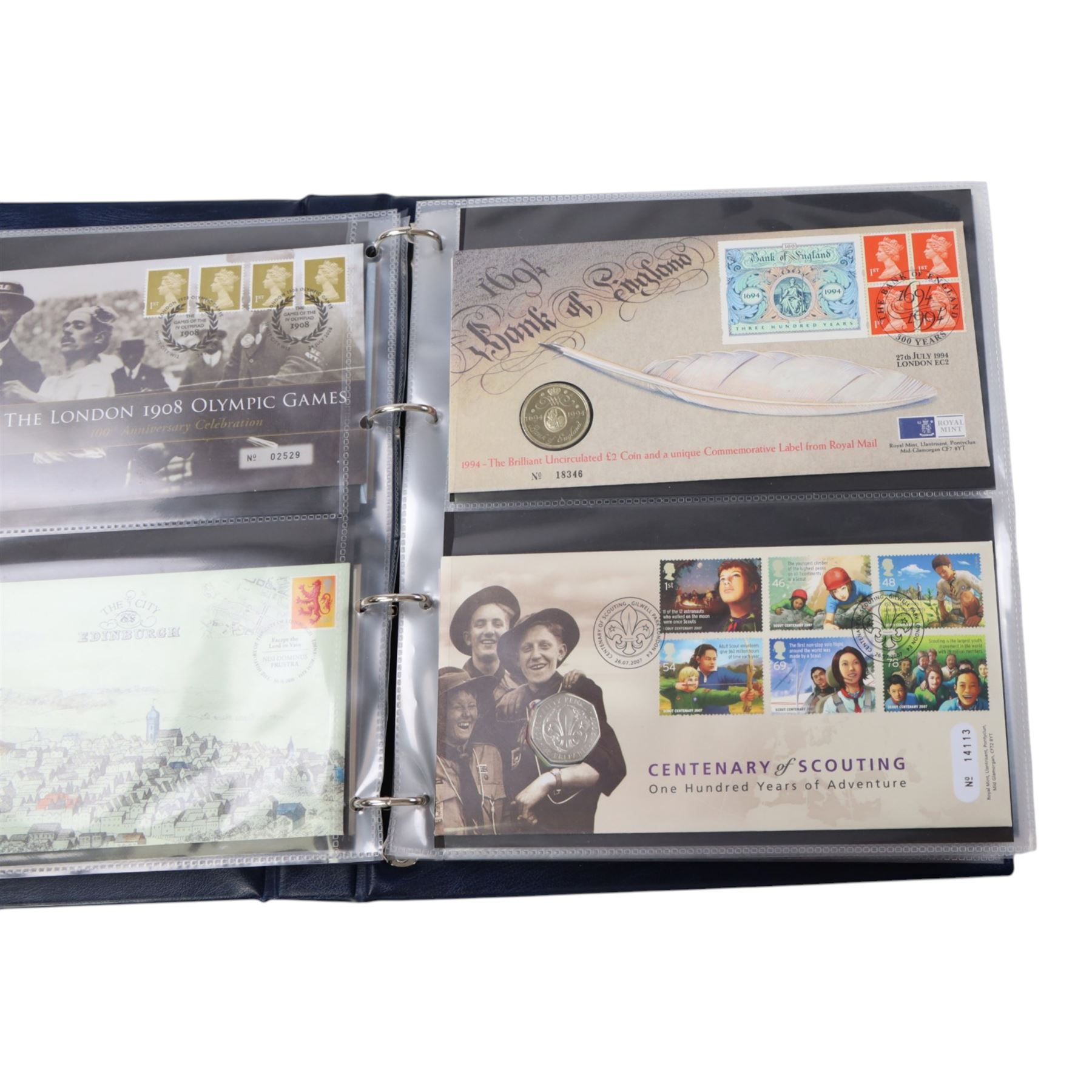 Approximately 104 Royal Mail Royal Mint coin or medallion covers, housed in an official Royal Mail Royal Mint ring binder folder and loose, together with The Queen's Golden Jubilee Coin Cover Collection in two albums, commemorative fifty pences, crowns, etc