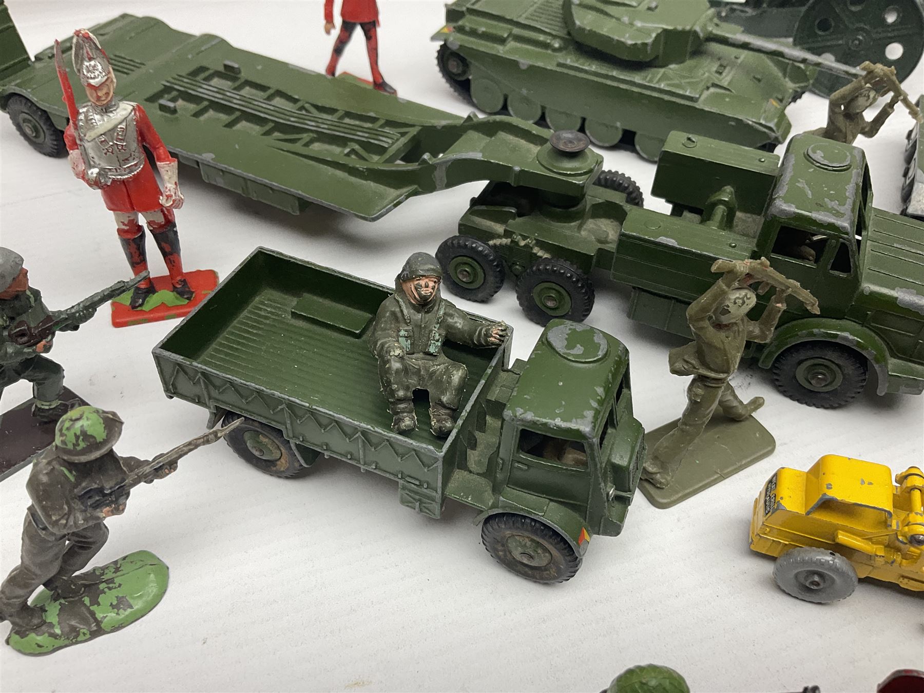 Various makers - unboxed and playworn die-cast models including Dinky Thornycroft Mighty Antar Tank Transporter No.660 and Centurion Tank No.651, other military and farm vehicles; and quantity of loose plastic soldiers and other figures by Crescent, Britains etc