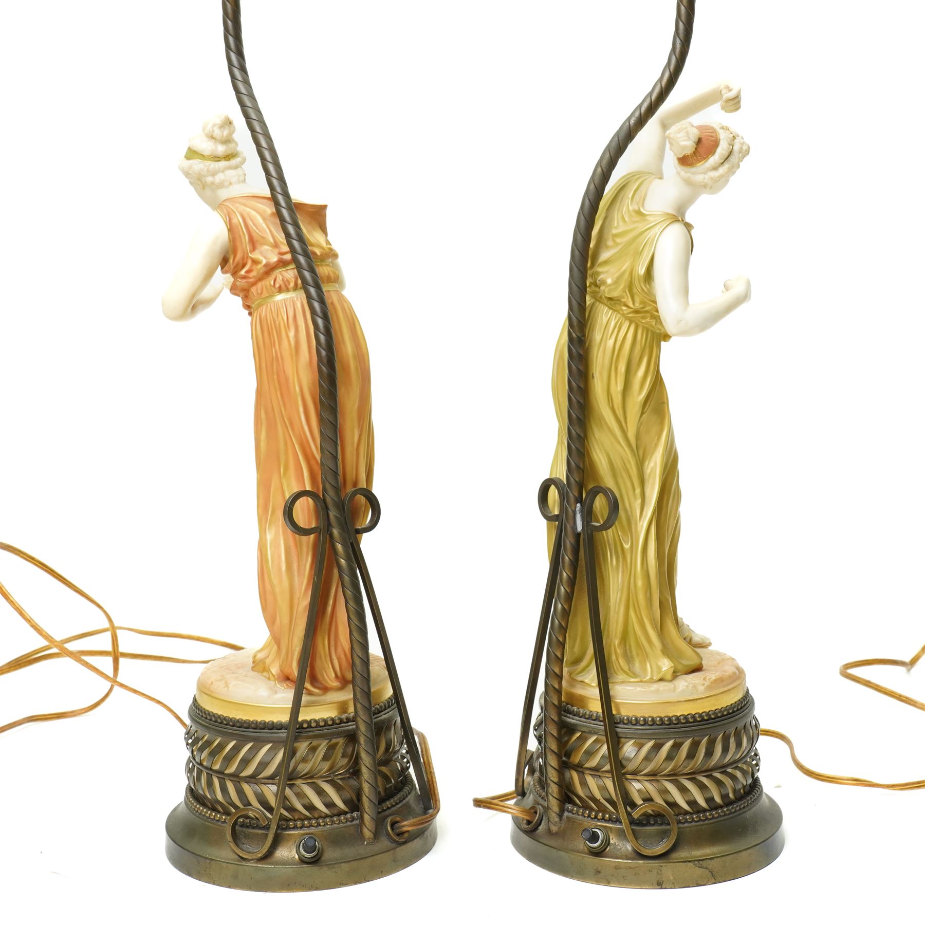Pair of Royal Worcester table lamps modelled by James Hadley with female musicians with two branch metal fittings and filigree finials on circular bases H75cm