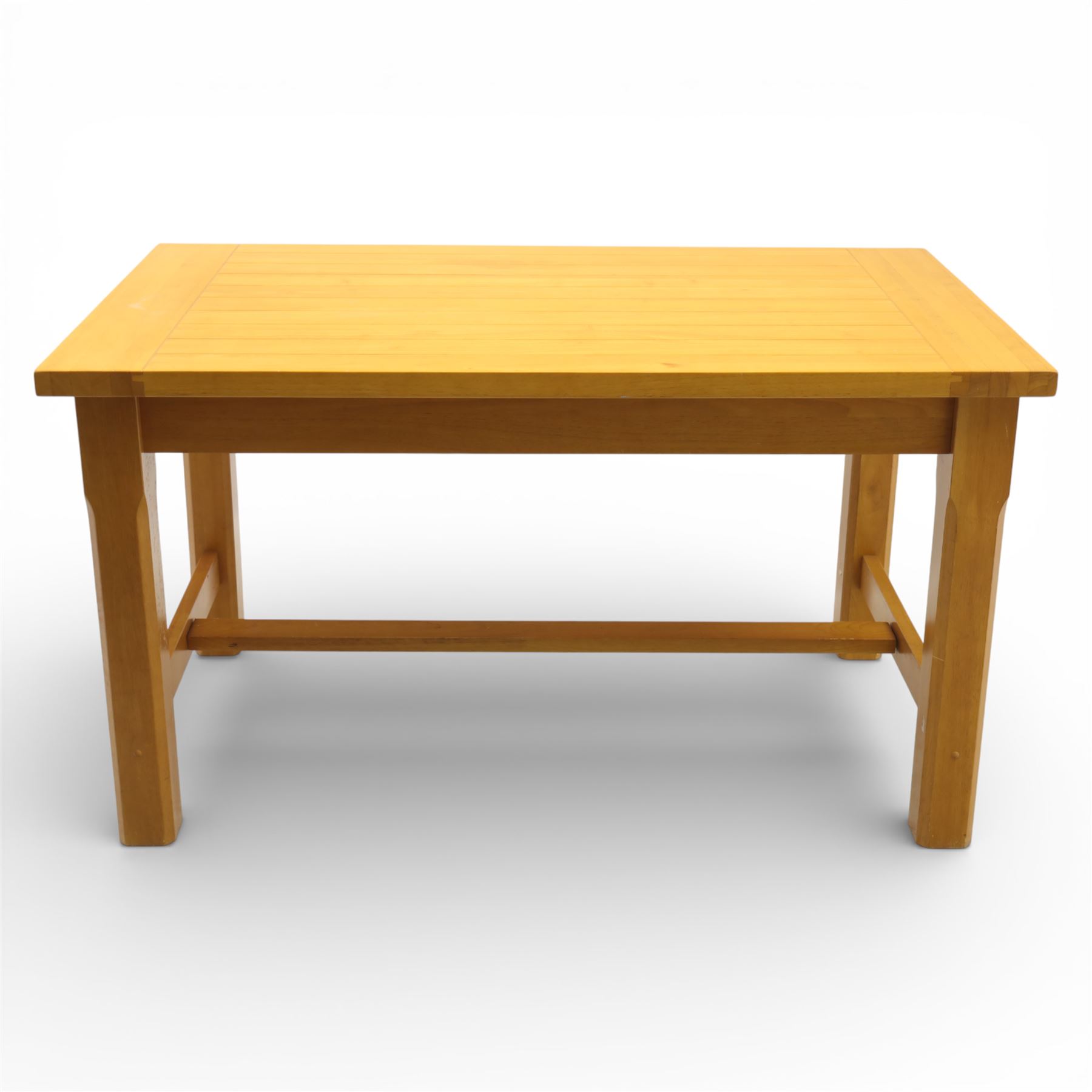 Solid oak dining table and set of seven pine farmhouse chairs including two carvers, rectangular top with tongue and groove style finish, supported a 'H' stretcher with square chamfered legs, pine farmhouse chairs with central splat and turned legs