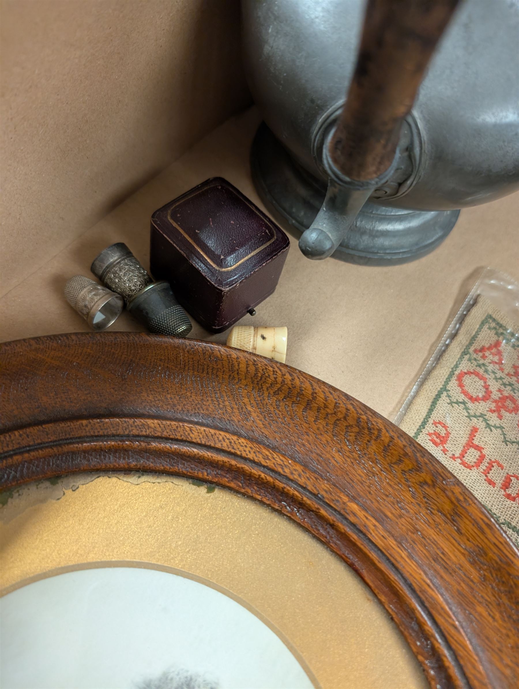 Burmese red lacquer circular box, pewter coffee pot, wooden book slide and circular photograph frames, thimbles including silver example, sampler and a small collection of vintage dolls house furniture