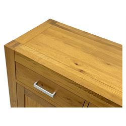 Light oak sideboard, fitted with three drawers and three cupboards, metal handles
