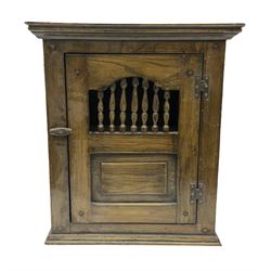 Oak dole cupboard / food hutch, the hinged panelled door with turned spindles enclosing a single shelf interior, H52cm D17cm W46cm