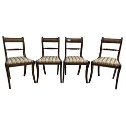 Set of four Regency period mahogany dining chairs, rope-twist centre back bar over pink and ivory floral patterned drop-in seats, on reed moulded sabre supports