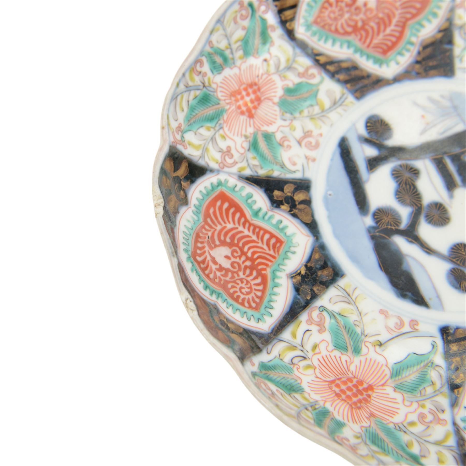 Group of 19th century Japanese Imari porcelain, Meiji period, comprising pair of lobed dishes, decorated stylised reserves and painels in blue and gilt upon a red ground, H6.5cm D21.5cm, a pair of plates of circular lobed form, decorated with a central panel depicting a vase beneath pine branches, and surrounded by panels of flowers and stylised quatrefoil shapes, D21cm, and another similar example painted with a character in underglaze blue to the centre, with character mark beneath, D22cm, each with character marks beneath               