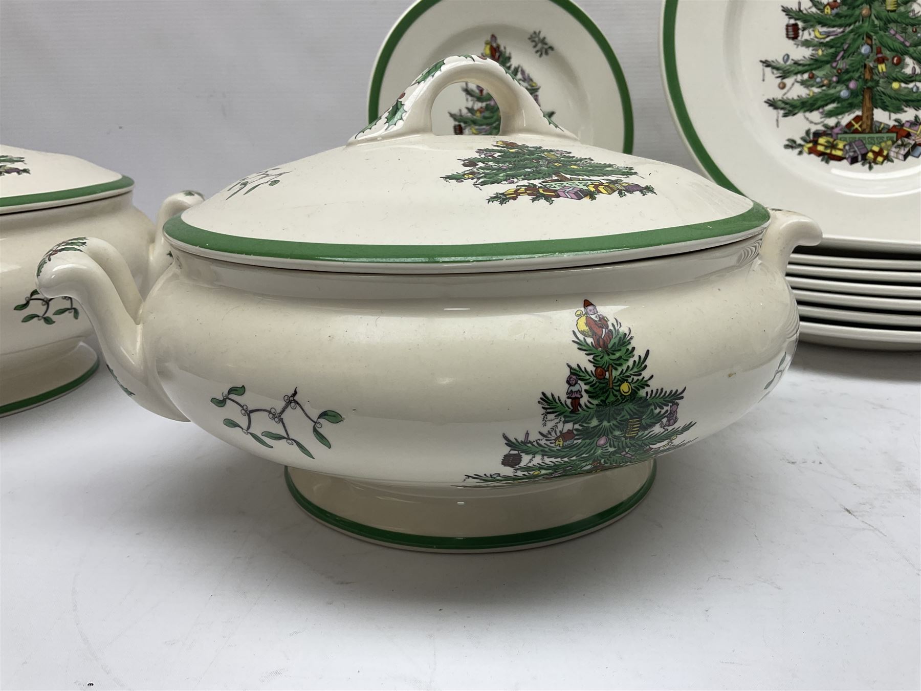 Collection of Spode Christmas Tree pattern part dinner service, comprising three covered tureens, eight dinner plates, eight side plates, eight dessert plates, sauce boat and saucer and serving platter (30)