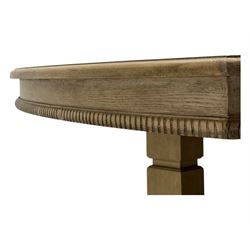 Brunswick - washed oak finish extending dining table, rectangular top with curved ends and carved frieze, central extension leaf, raised on twin pedestals with arched plinth bases and square-sectioned column supports; set of eight (6+2) high-back dining chairs upholstered in beige velvet fabric