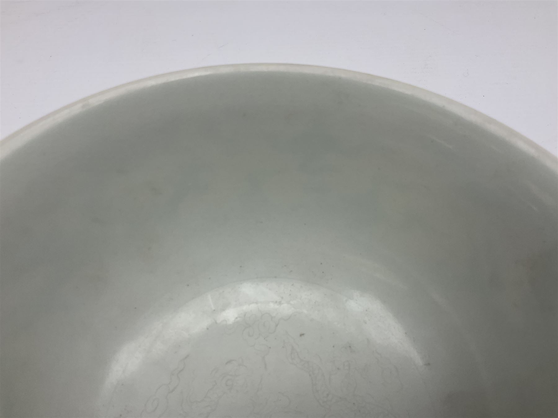 Pair of Chinese famille jaune bowls, decorated in green enamel with a dragon chasing a flaming pearl amongst clouds, upon a yellow ground, the interior decorated to centre with dragon, with six character mark beneath, D17.5cm