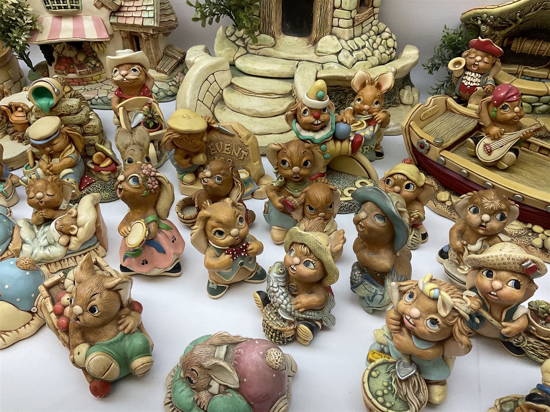 Extensive collection of Pendelfin rabbits and stands, to include Betsy Barge, Fruit Shop, Uncle Soames, Event Piece etc, many with original boxes 