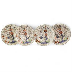 Set of four early 19th century Derby porcelain bowls decorated in the 'Tree of Life' pattern, in the imari palette, within shaped gilt borders, D26cm (4)