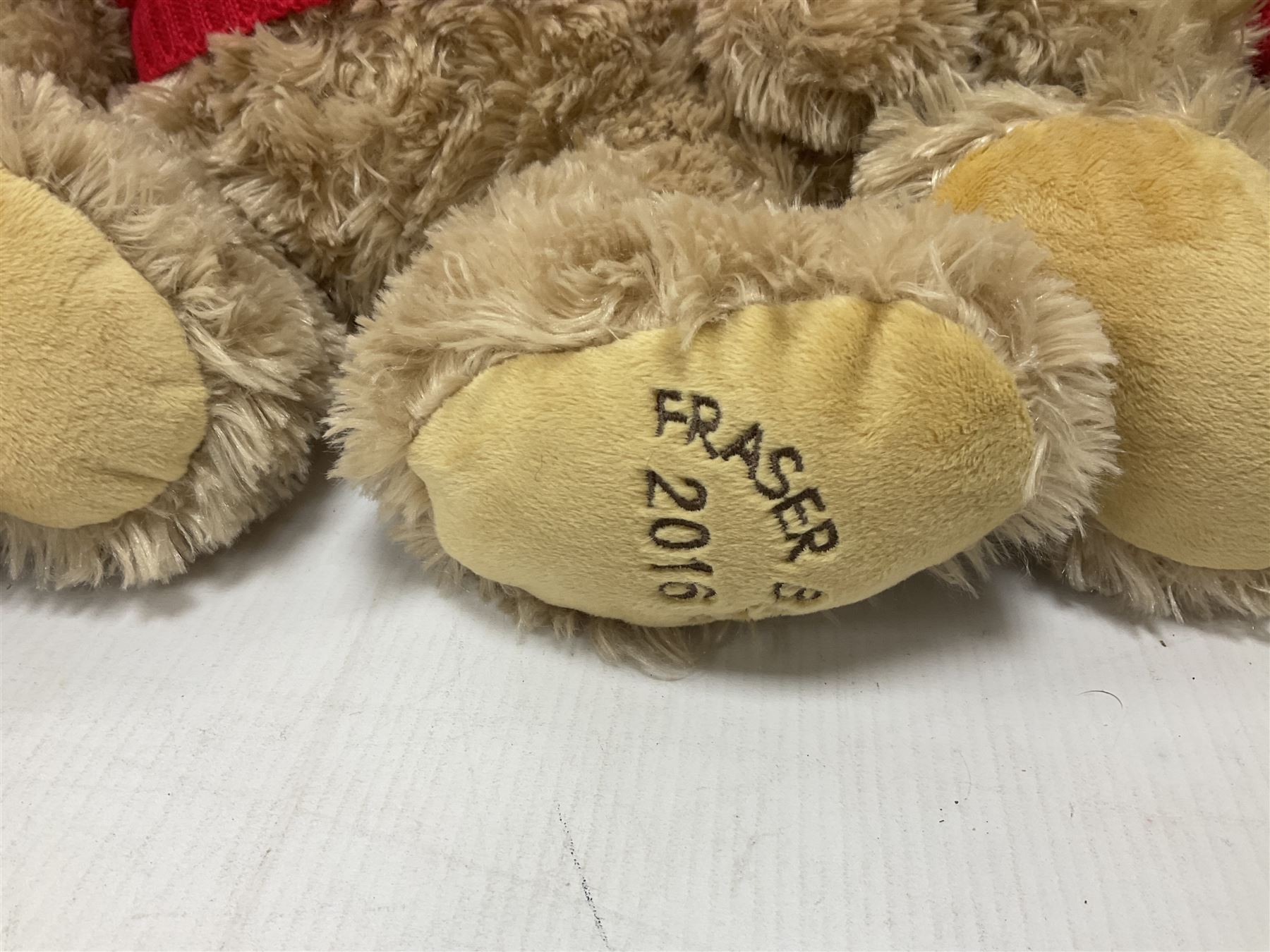 Eight annual Fraser Bears, by House of Fraser, dating between 2012 and 2019, tallest H35cm