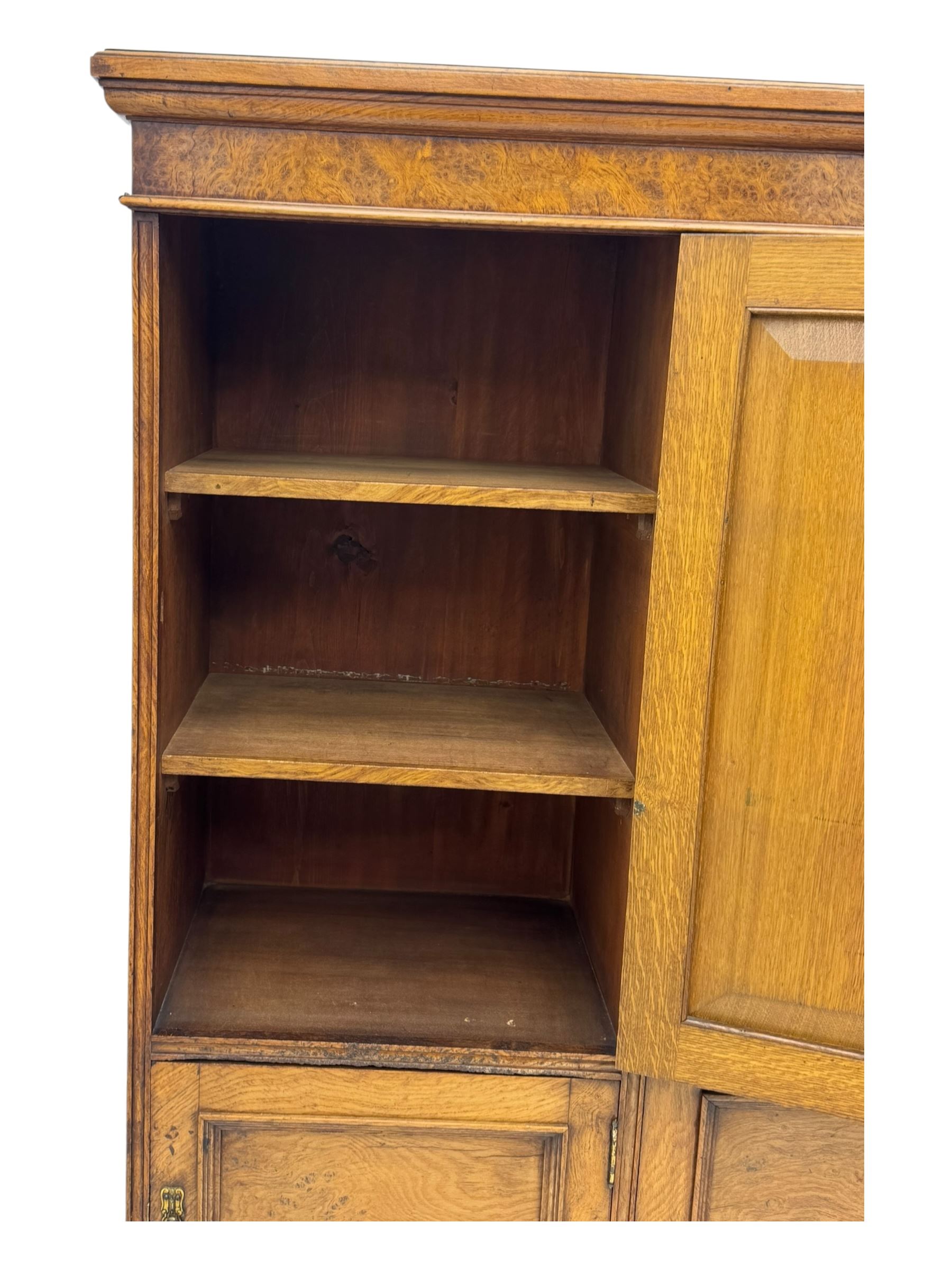 Late Victorian pollard oak bookcase or sideboard, the central glazed door opening to reveal adjustable shelves and interior makers label 