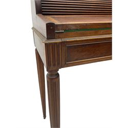 Early 20th century French plum pudding mahogany petite writing desk, barrel tambour roll top, fitted with a single cock-beaded drawer activating the tambour roll, the fold-over writing slope with inset writing surface supported by long drawer, fitted with three small drawers and pen rail, raised on fluted tapering supports