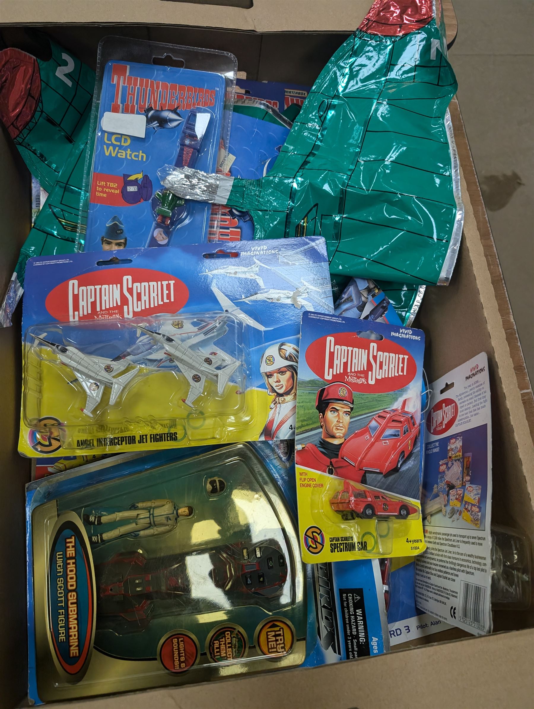 Gerry Anderson interest collectables and toys, including Carlton Thunderbirds Tracy Island, Matchbox Stingray Marineville Headquarters, both boxed, Matchbox carded Thunderbirds and Stingray figures and vehicles, Captain Scarlet and Joe90 collectables, etc