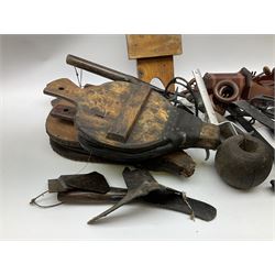 Cast iron stirrups, traps, tools and other metal ware, wood and leather bellows and other treen etc