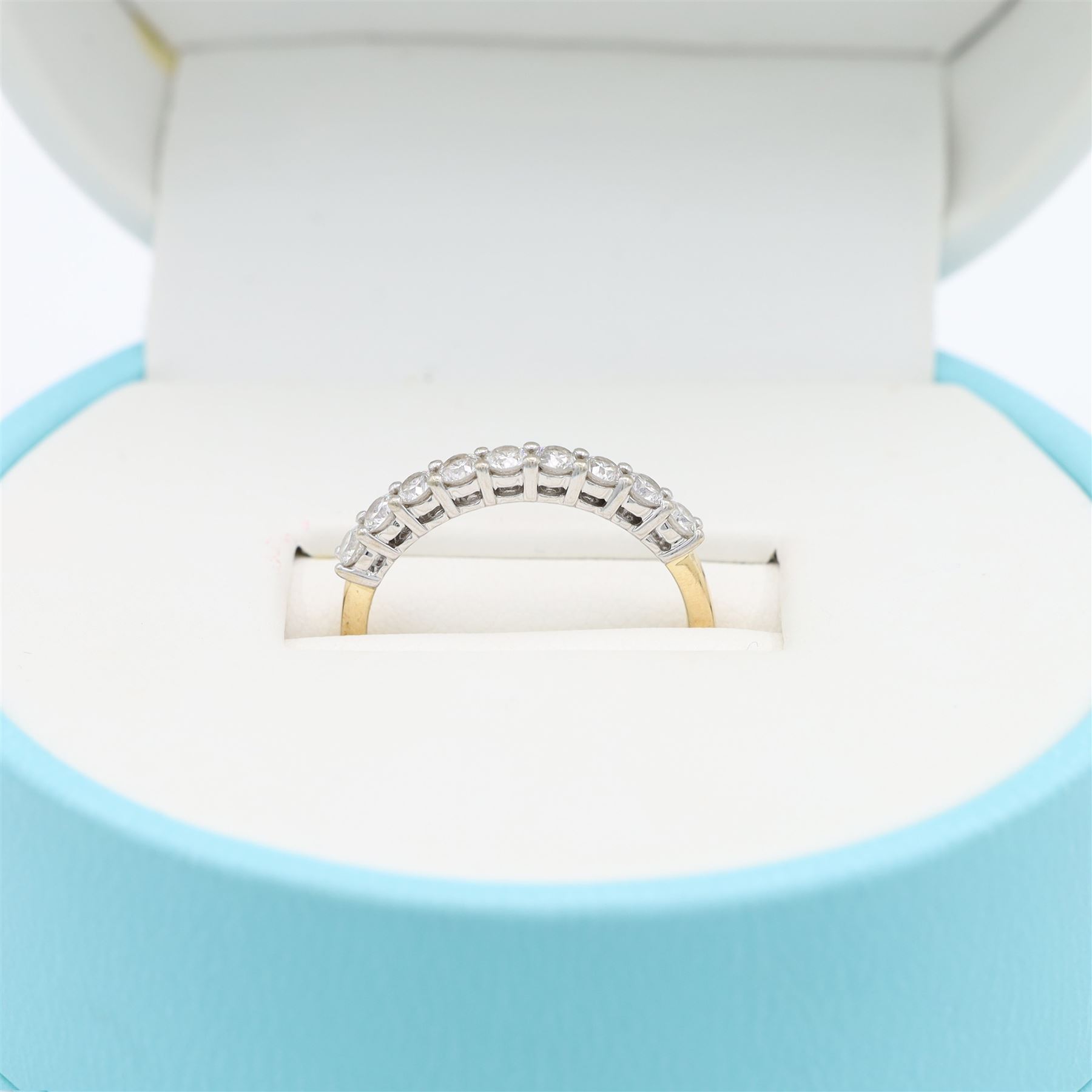14ct gold diamond half eternity ring, set with nine blossom cut diamonds, stamped 14K, total diamond weight 0.54 carat, with GGI certificate