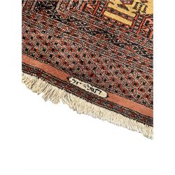 Afghan red ground runner rug, the field decorated with eight Gul motifs, the multi-band with repeating lozenges 
