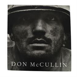 McCullin, Don: three hardback books, comprising 'Shaped by War', 'Hearts of Darkness' and a self titled example, together with a framed Times magazine cover depicting the photographer in black and white, signed to the left hand side