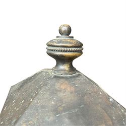 Early 20th century brass and cast iron garden lantern or street light, turned finial over four panel glazed body, cast iron base