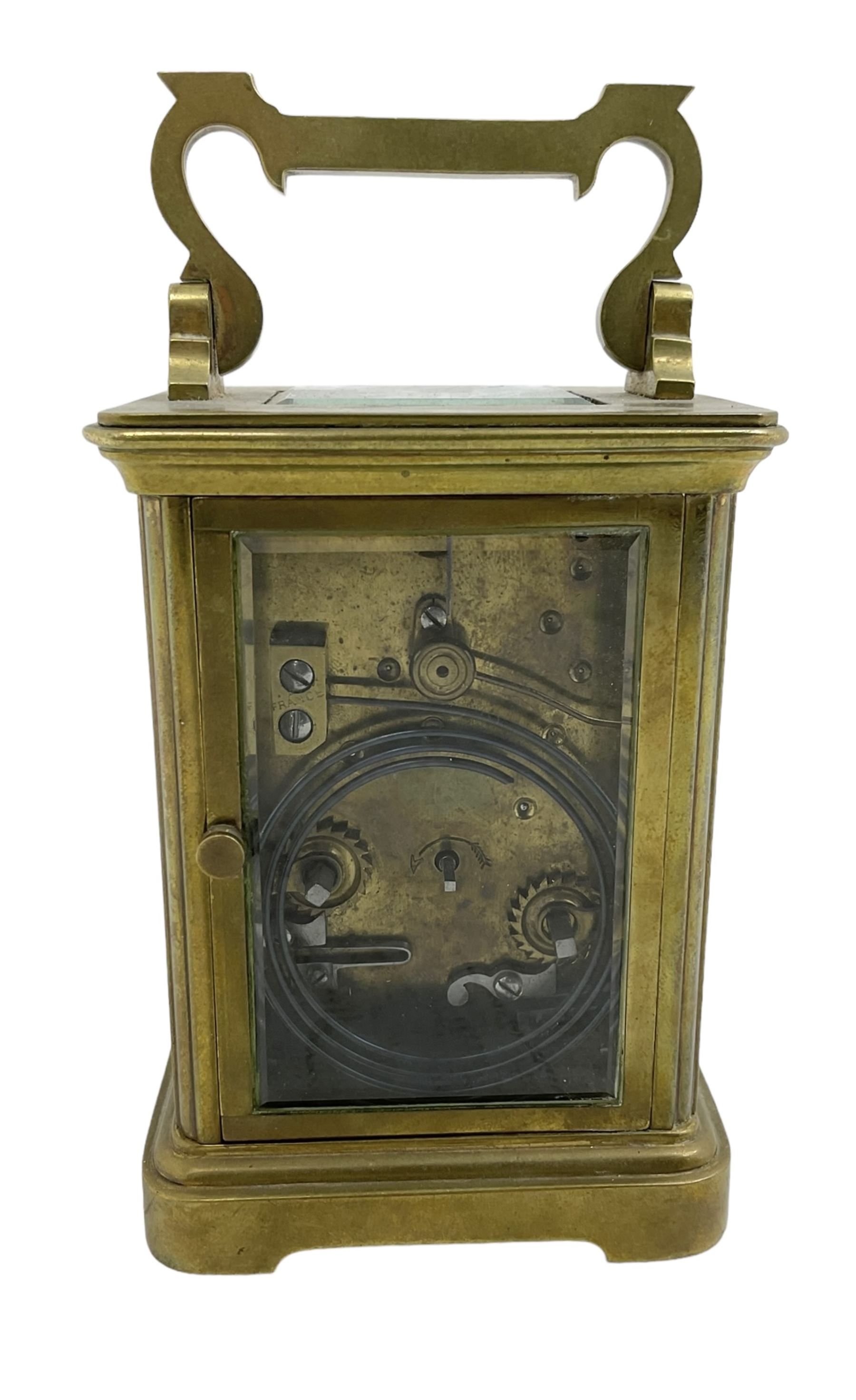 French - late 19th century 8-day carriage clock, in an Anglaise case with a rectangular glass panel to the top, enamel dial with Roman numerals, minute track and spade hands, rack striking movement, striking the hours and half hours on a coiled gong, with a lever platform escapement.  