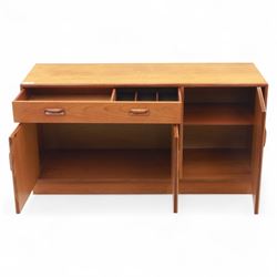 G Plan - Mid-20th century teak sideboard, fitted with single drawer above three cupboard doors, recessed handles throughout, raised on a plinth base