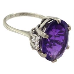 White gold oval amethyst ring, each side set with three round brilliant cut diamonds, stamped 18ct, the inner shank engraved and dated 19'73