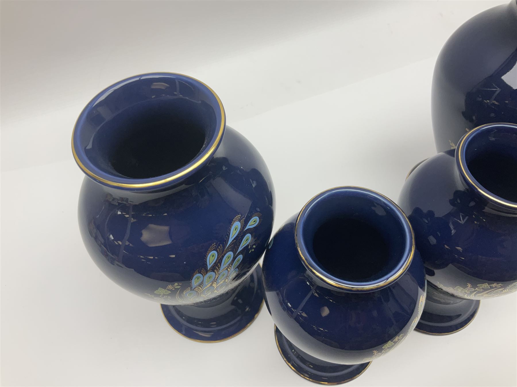 Two pairs of Royal Winton vases, decorated with peacocks on a blue ground, largest H24cm