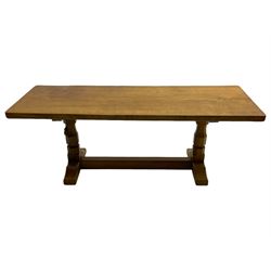 Mouseman - oak coffee table, rectangular adzed top on twin octagonal pillar supports, sledge feet united by floor stretcher, carved with mouse signature, by the workshop of Robert Thompson, Kilburn 