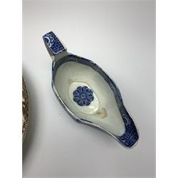 Early 19th century David Dunderdale & Co Castleford pottery plate, decorated in brown in the Buffalo and Ruins pattern, with indistinct impressed marks beneath, D24cm, together with a late 18th/early 19th century blue and white pearlware sauce boat, decorated in a variant of the Willow pattern, L15cm