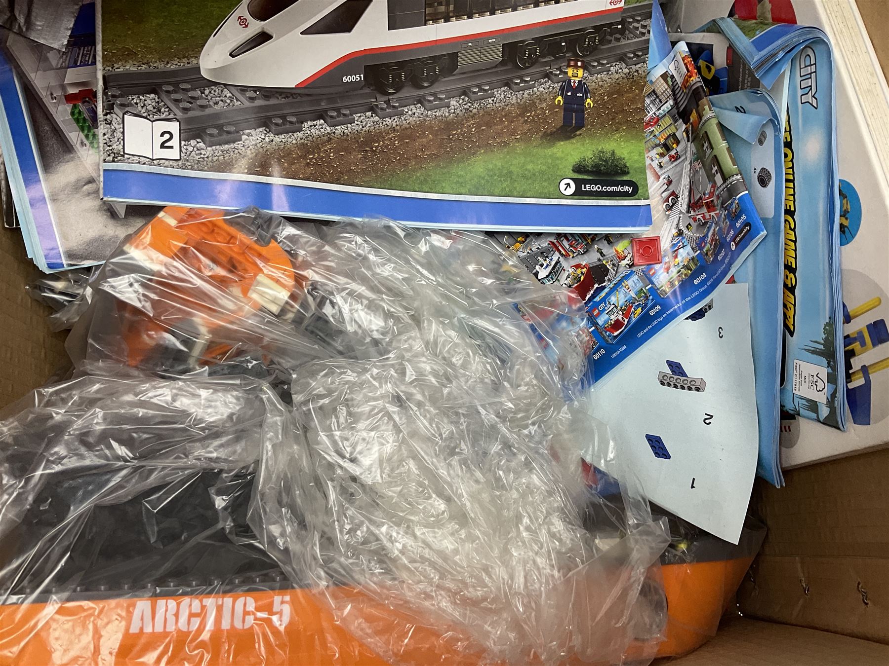 Very large collection of Lego, predominantly loose but some part constructed models, including Lego City, Lego Technic, Chima, Arctic 5, train set, mobile crane etc; together with numerous instruction booklets and some empty boxes; contained in two large cardboard boxes with gross weight of over 24kgs