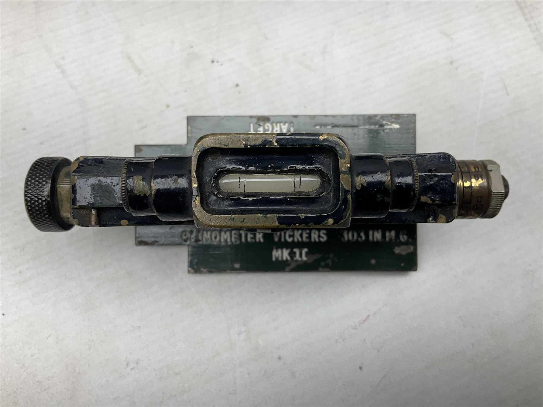Cooke Troughton & Simms grey painted brass dumpy level in carrying case; and WW2 British .303 Vickers Machine Gun brass Clinometer, stamped 'V.E. 0067' serial No. 2370,  dated 1944 unboxed (2)