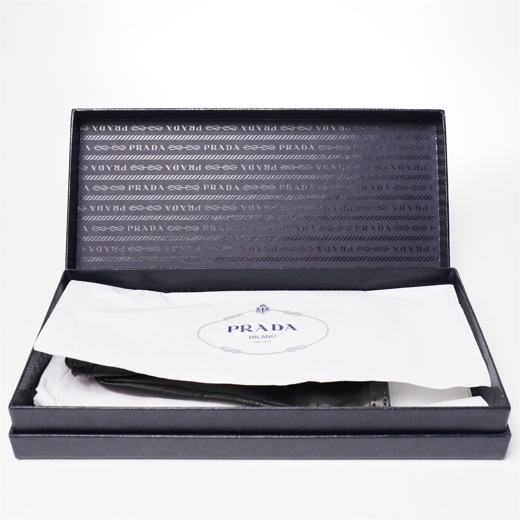Prada - pair of black lambskin leather gloves, with enamel gold-tone and black triangle logos and silk lined interior, unused with original box