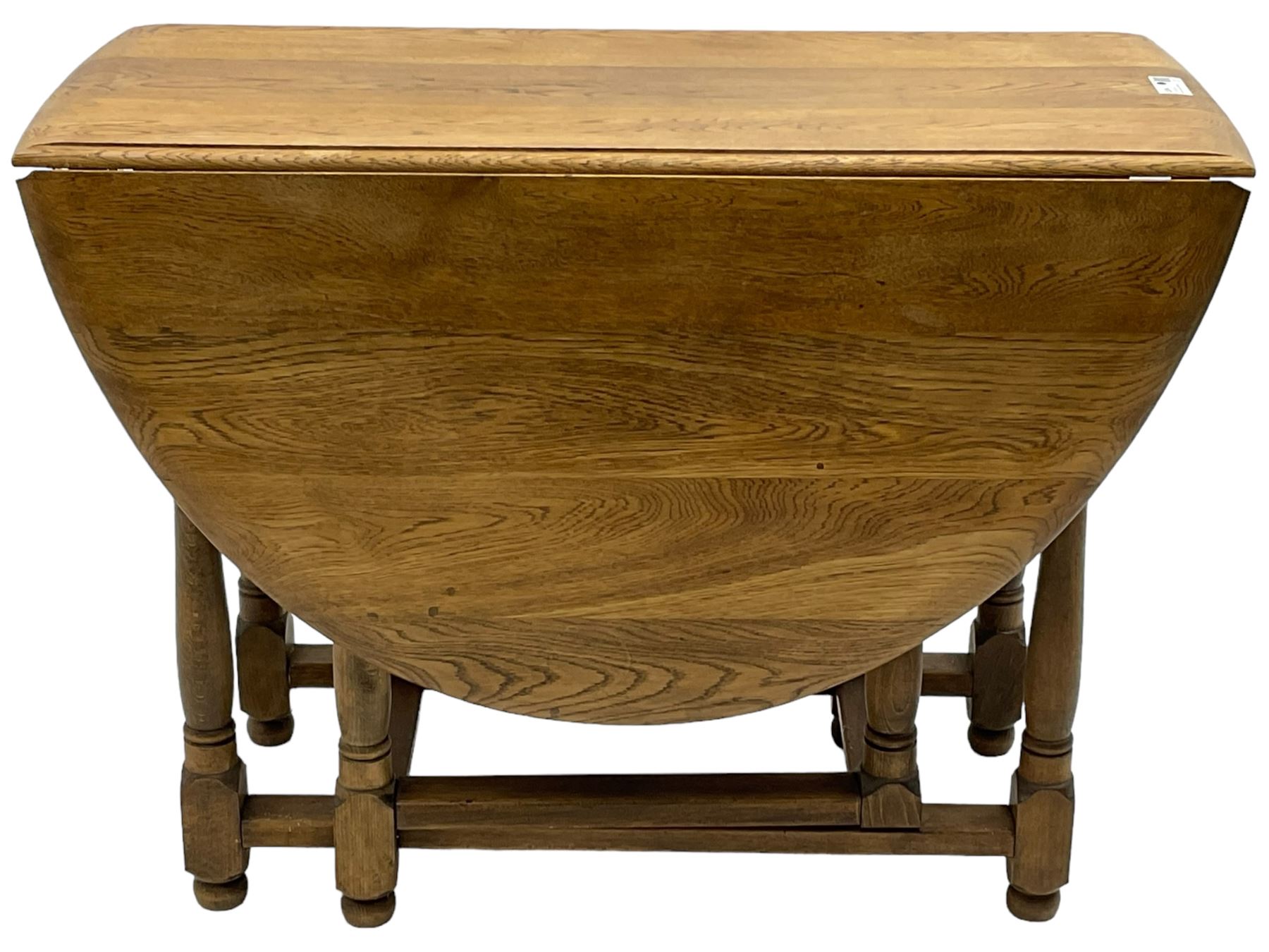 Mid-to-late 20th century oak and beech drop-leaf dining table, gate-leg action base with turned supports