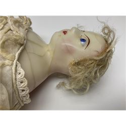 Victorian wax shoulder head doll with pale complexion, applied hair, inset glass eyes and fabric covered jointed body with kid leather lower arms; white linen dress and undergarments H50cm