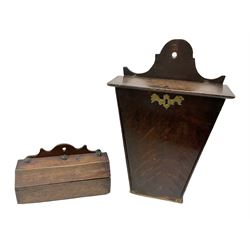Two oak George III hanging candle boxes, the first example being of tapering rectangular form with brass escutcheon and the further being of octagonal form with studded leather hinges, tallest H43ccm