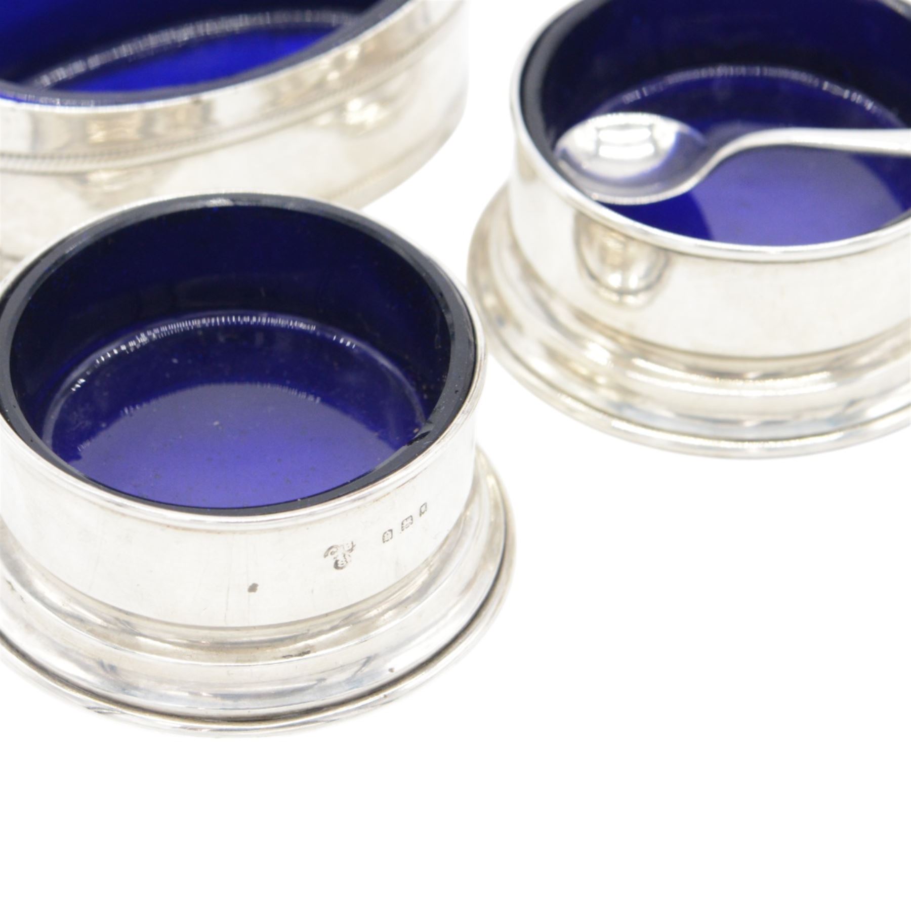 Group of silver cruet items, comprising pair of Art Deco salt and pepper shakers, of tapering cylindrical form, hallmarked Viner's Ltd, Sheffield 1933, pair of silver open salts, pair of salt shaker, and a matching pepper shaker and open salt, all hallmarked