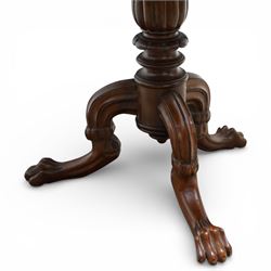 19th century mahogany centre table, with circular tilt top on a turned and reeded column, raised on three carved cabriole legs terminating in paw feet
