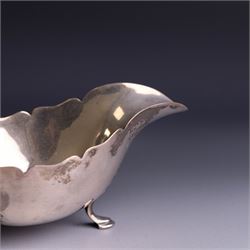 1930s silver sauceboat, of typical form with shaped rim and flying C scroll handle, upon three stepped feet, hallmarked Collingwood & Sons Ltd, Sheffield 1938