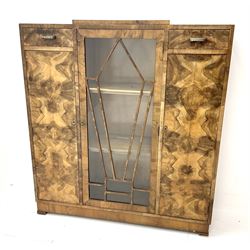 Art Deco walnut display cabinet, central astragal glazed door flanked by two drawers and two cupboards 