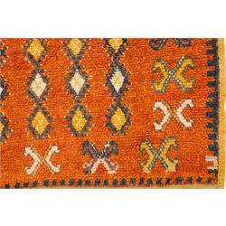 North Persian tribal rug, an orange field and six rows of lozenges, with a border of ram's horn motifs