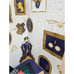 Eleven JK Rowling books, comprising six Harry Potter books, including four first editions, Fantastic Beasts screen play, Harry Potter and the Cursed Child, Tales of Beedle the Bard, Casual Vacancy first edition, Christmas Pig First edition and a Harry Potter card board back drop