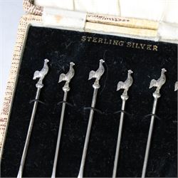 Set of six silver cocktail sticks, each with cockerel finials, stamped Sterling Silver, in fitted case