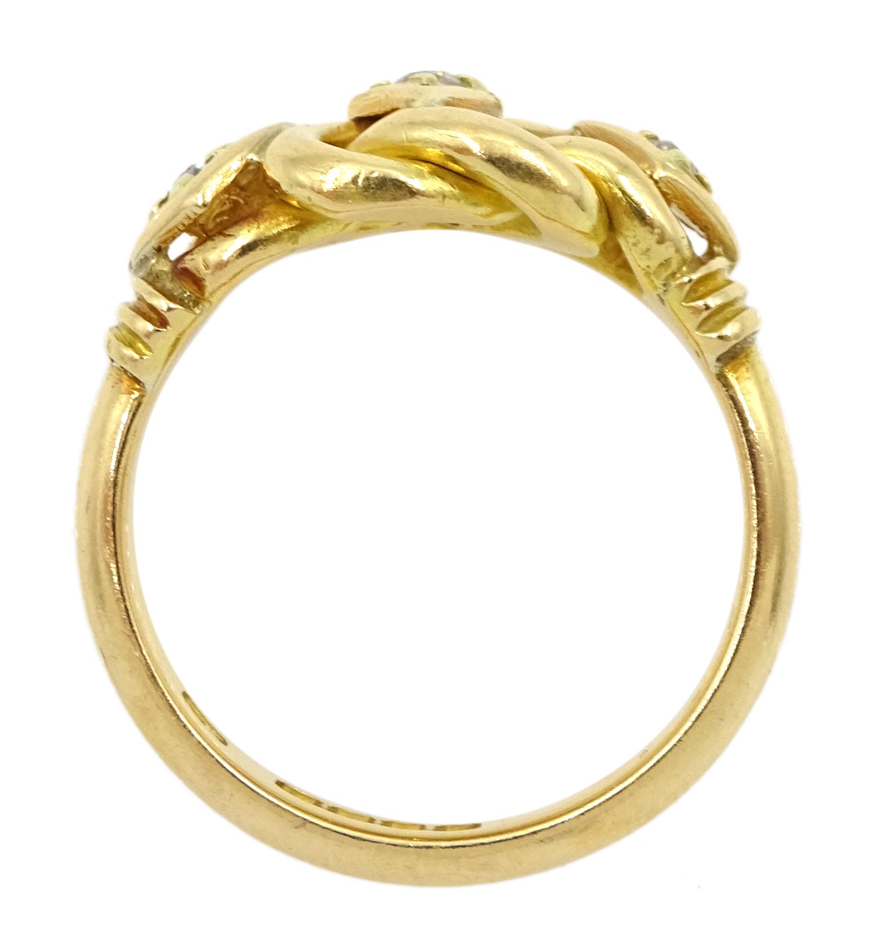 Edwardian 18ct gold three stone old cut diamond love knot ring, maker's mark EK, London 1903
