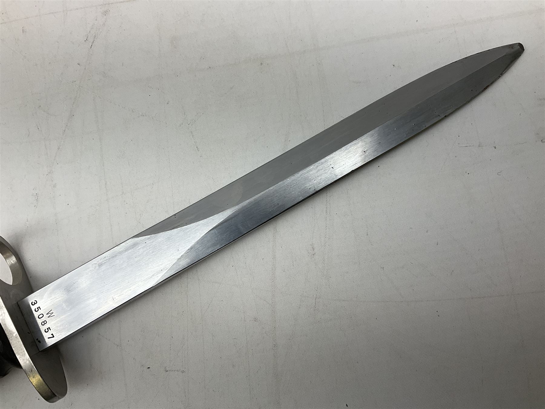 Swiss Model 1957 SIG rifle bayonet by Wenger with 23.5cm steel blade numbered 350857; in plastic scabbard with leather frog stamped GSCH 85 L38cm overall; and Egyptian Hakim rifle bayonet with the same script number to the grip and steel scabbard (2)