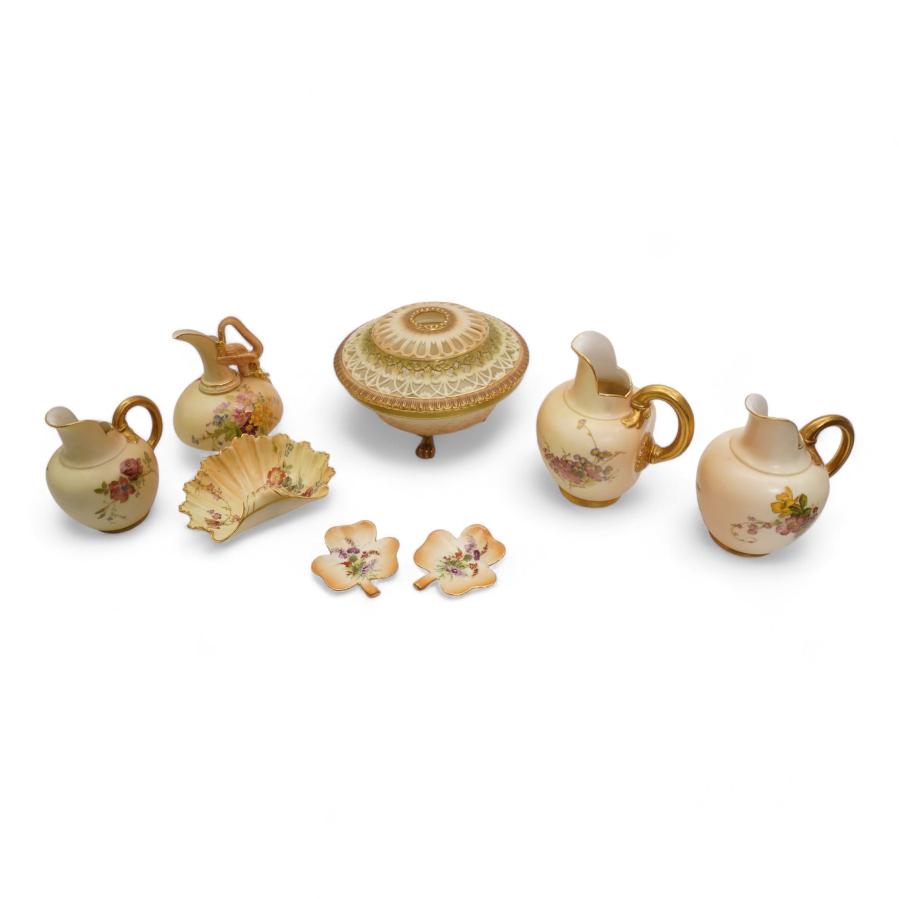 Royal Worcester blush ivory porcelain to include a pot pourri bowl with pierced cover, no. G935, ewer with winged beast moulded handle no. 1048, three further ewers, no 1094, shell shaped dish no. 1413 and two similar style leaf shaped dishes (8)