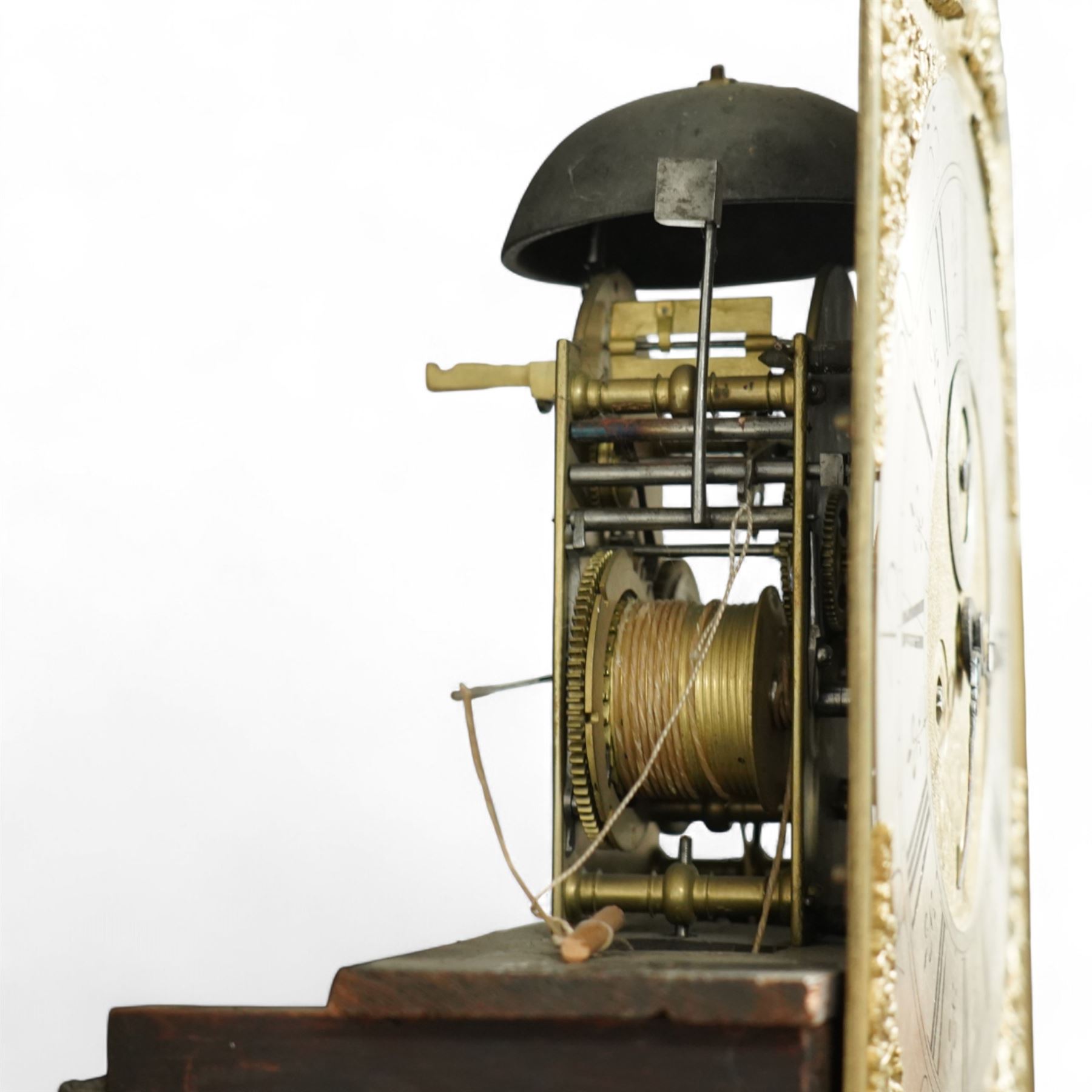 Man Beckett (I) of Stockton on Tees (Co Durham) - 8-day early 18th  century longcase clock in a  profusely carved oak case, with a caddy top, turned finials and attached barley twist pilasters to the break arch hood door, long trunk with carving and a conforming long rectangular door carved with a Celtic depiction of the tree of life, corresponding plinth with a carved and decorative base, break arch brass dial with a rounded brass surround, cast spandrels and silvered boss with the makers name to the arch, matted dial centre with seconds dial, ringed winding apertures, square date aperture and fettled steel hands, silvered chapter with Roman numerals, five minute Arabic's, half hour markers, minute and inner quarter hour tracks, dial pinned to a five pillar movement with inside countwheel striking and a recoil anchor escapement, striking the hours on a bell. With weights and pendulum.
Man Beckett (I), (first name is a biblical name short for Manasseh), was the first member of the Beckett family of prodigious clockmakers working in the North-East of England from 1720 until 1884.