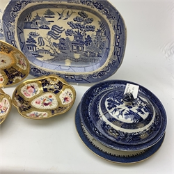  A selection of blue and white pottery, comprising four meat platters,  a Victorian drainer, two tureen and covers, one of rounded square form, the other of circular form, a Booths presentation plate, together with a further tureen and cover with stand, and a set of three dishes with hand painted floral and gilt decoration.   