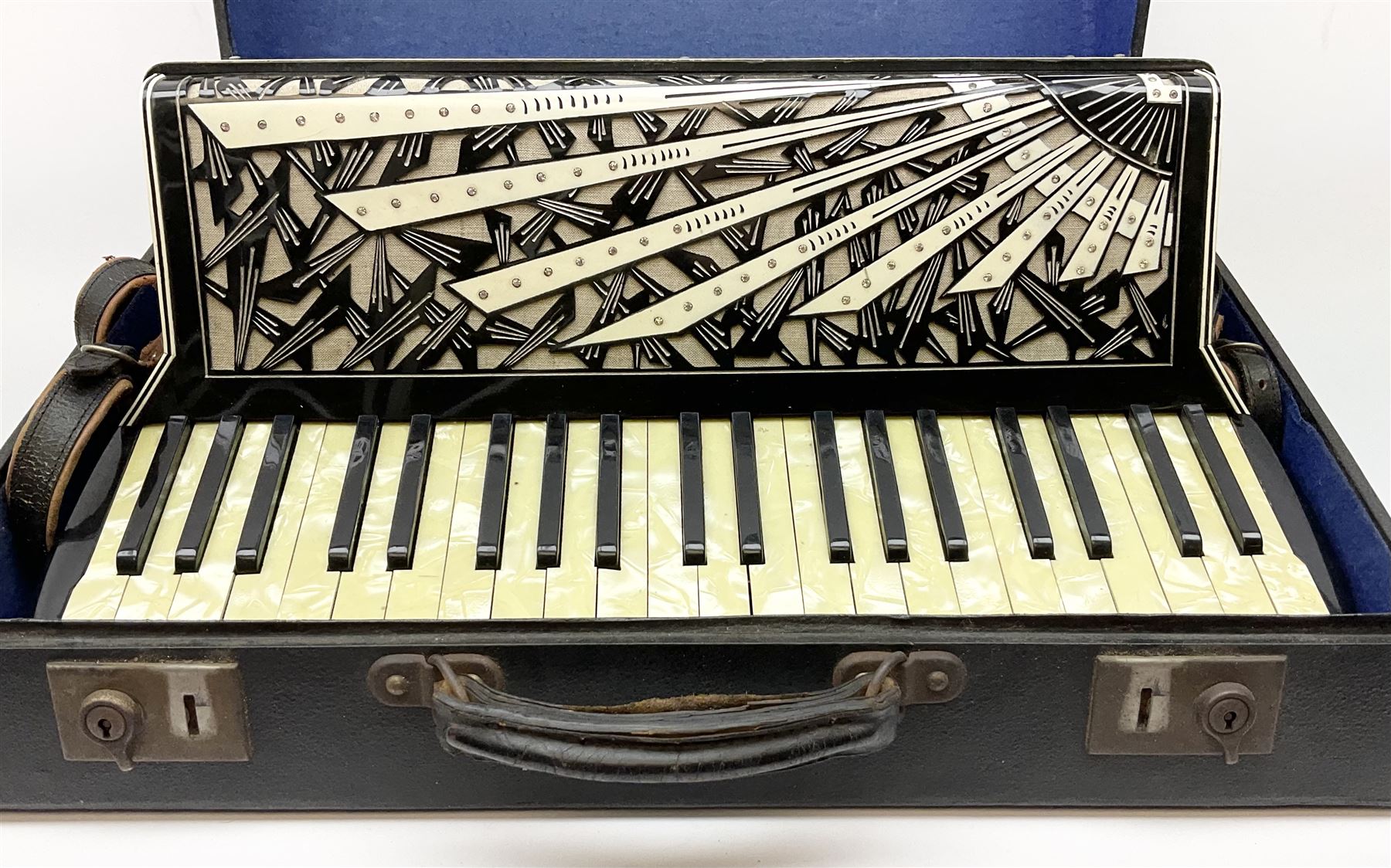 Italian Mantovani piano accordion with Art Deco style black and white case, twenty-four keys and one-hundred and twenty buttons L52cm in carrying case