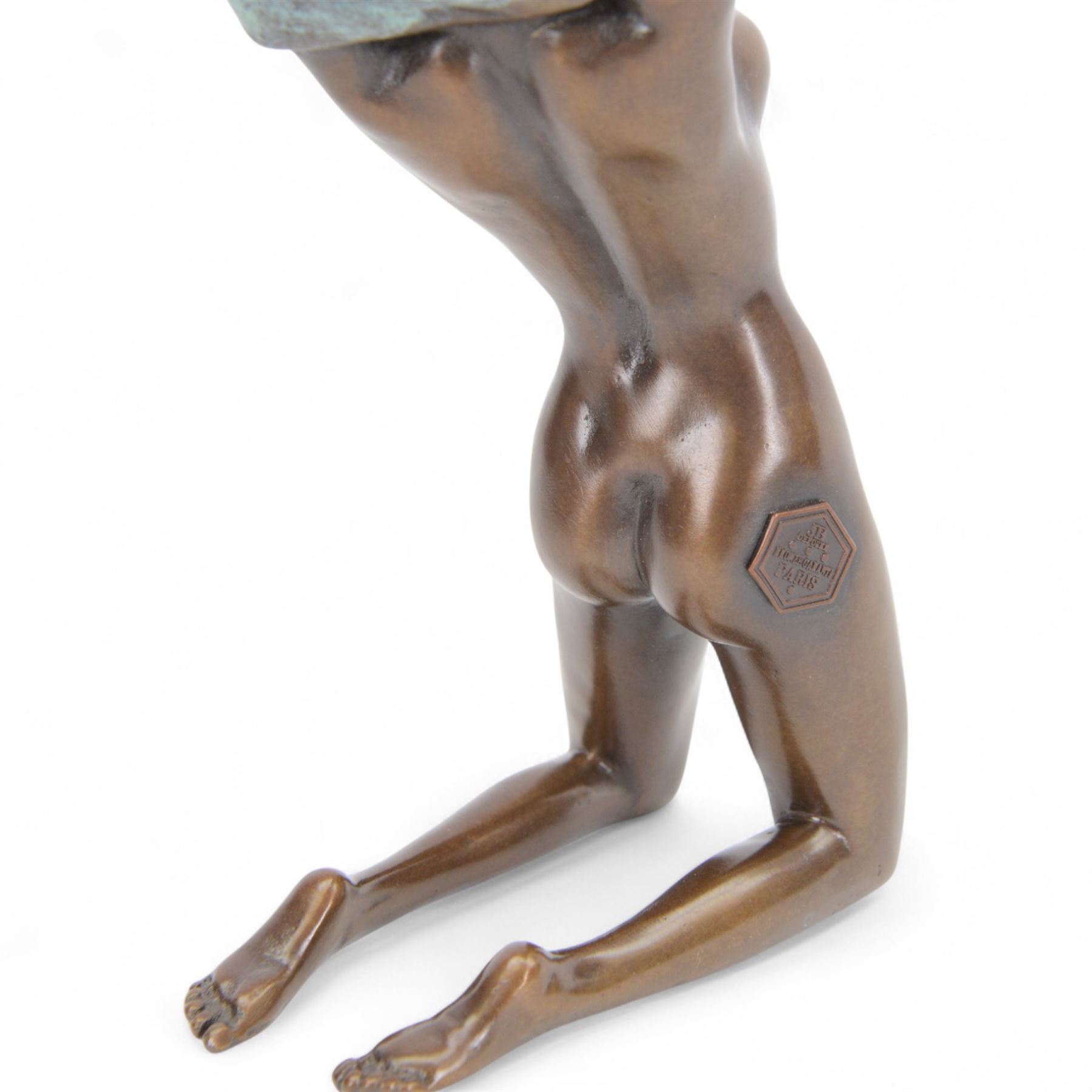 Bronze figure, modelled as kneeling nude woman removing her shirt, signed Milo, H17cm