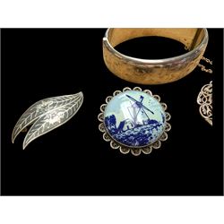 Silver bangle with four silver brooches
